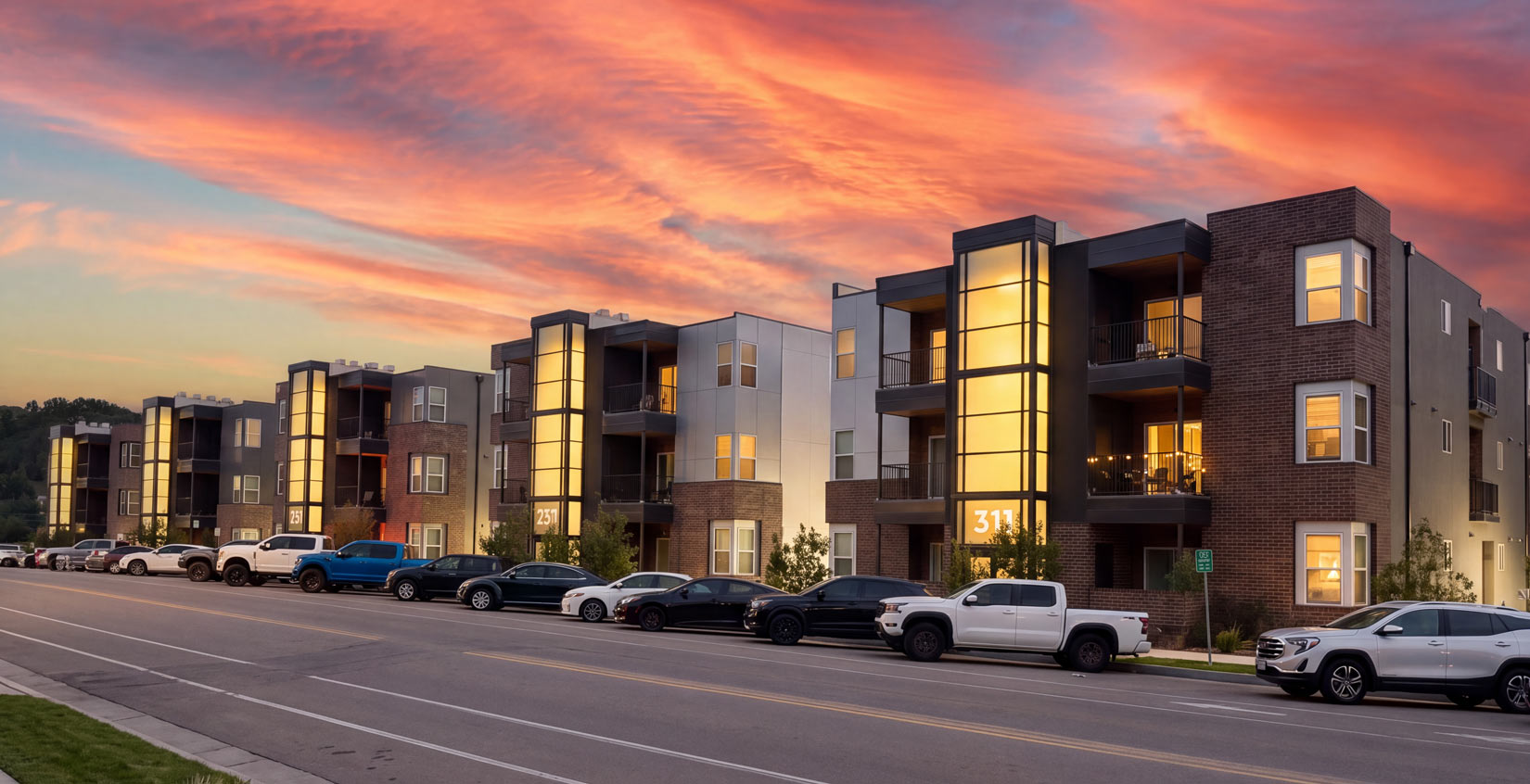 303 residential apartment community at dusk